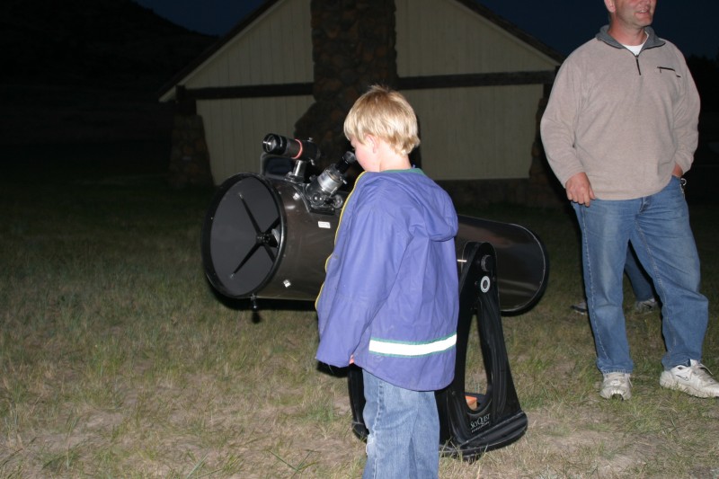 Child Using Telescope at Stargazing Under the Caverns Sky – Tom Forwood 
