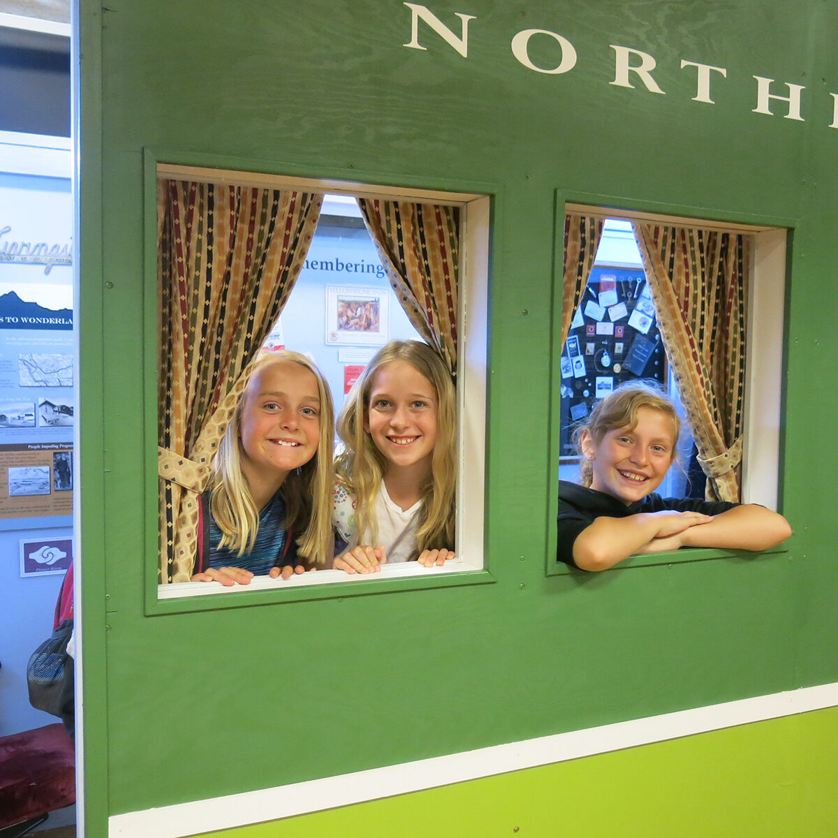Students enjoying the museum's Northern Pacific Railway North Coast Limited train car.