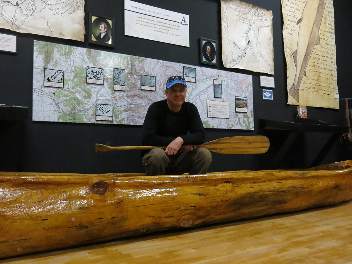 Norm Miller in Churchill Clark's dugout canoe, in Lewis and Clark exhibit.