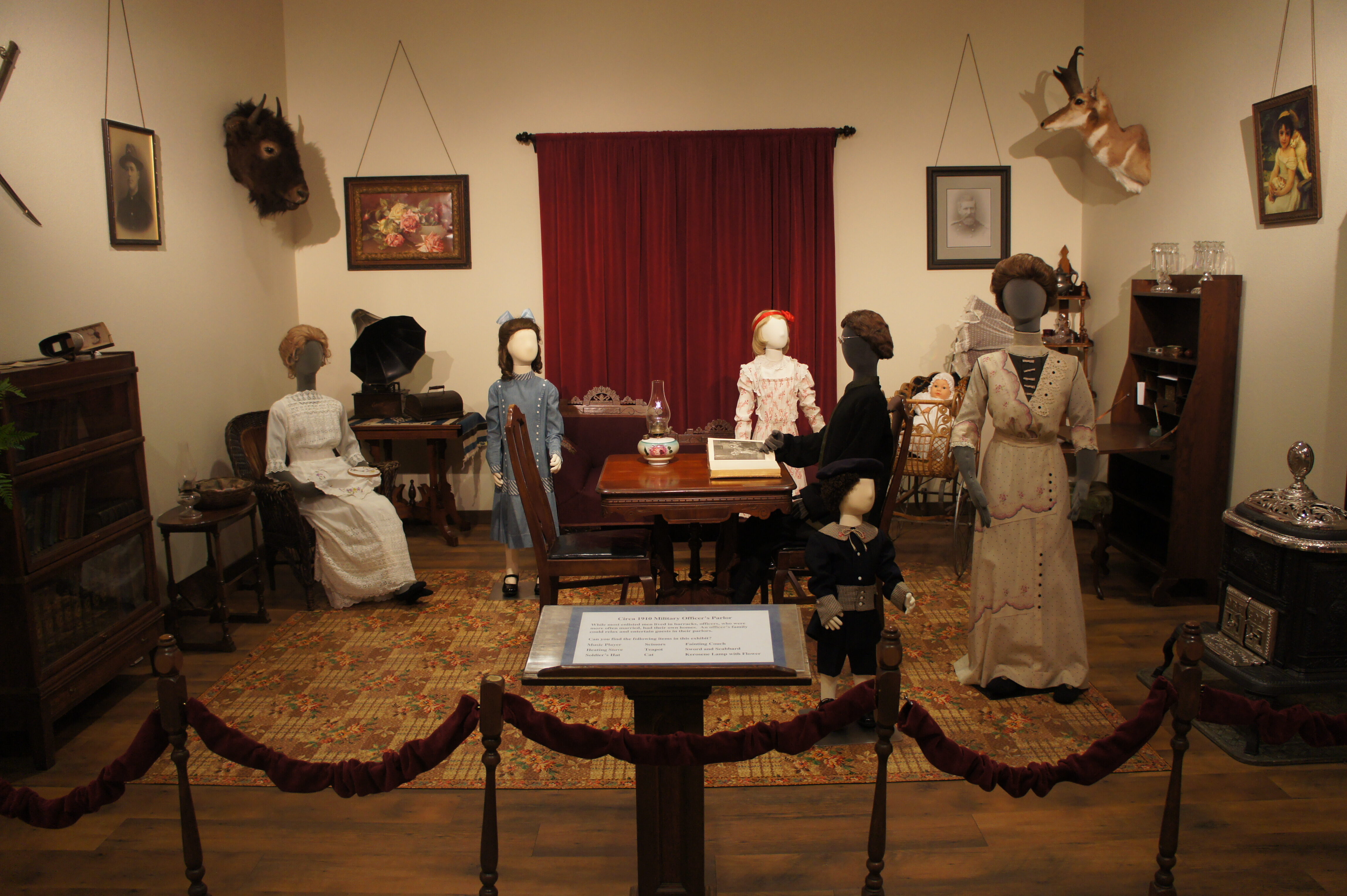 Military officer's parlor with mannequins and furniture pieces that date to 1910.