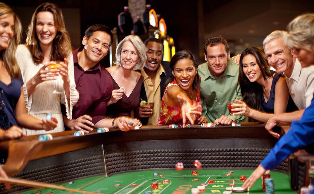 A group of people playing table games at Rivers Casino along the Lewis and Clark Historic Trail