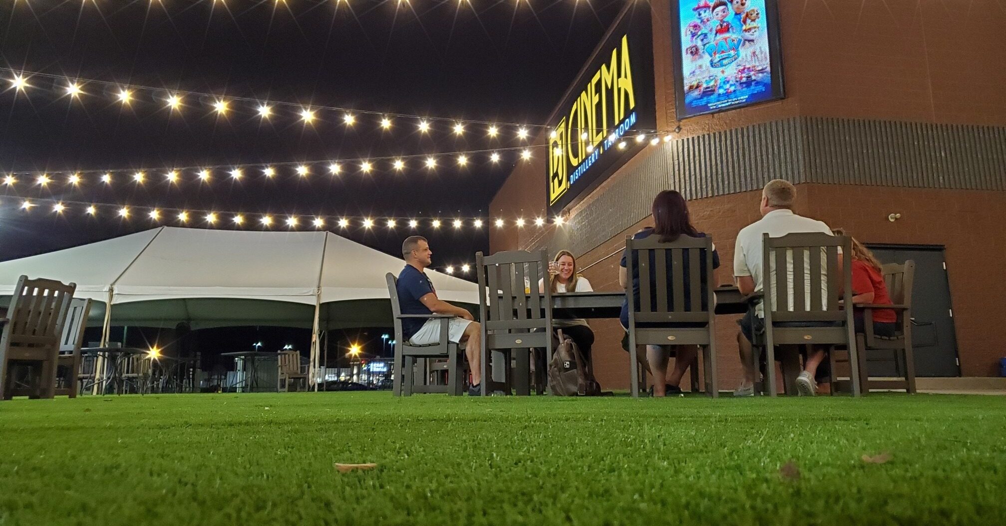 Outdoor seating in a large lawn outside of RJ Cinema along the Lewis and Clark Historic Trail