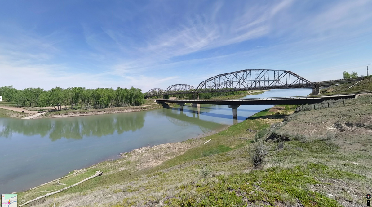 The new and old Wolf Point Bridge. The park can be seen across the river.